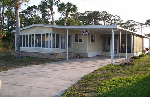 Finished DIY screen and vinyl room addition on a Florida home, built with Landis Aluminum materials